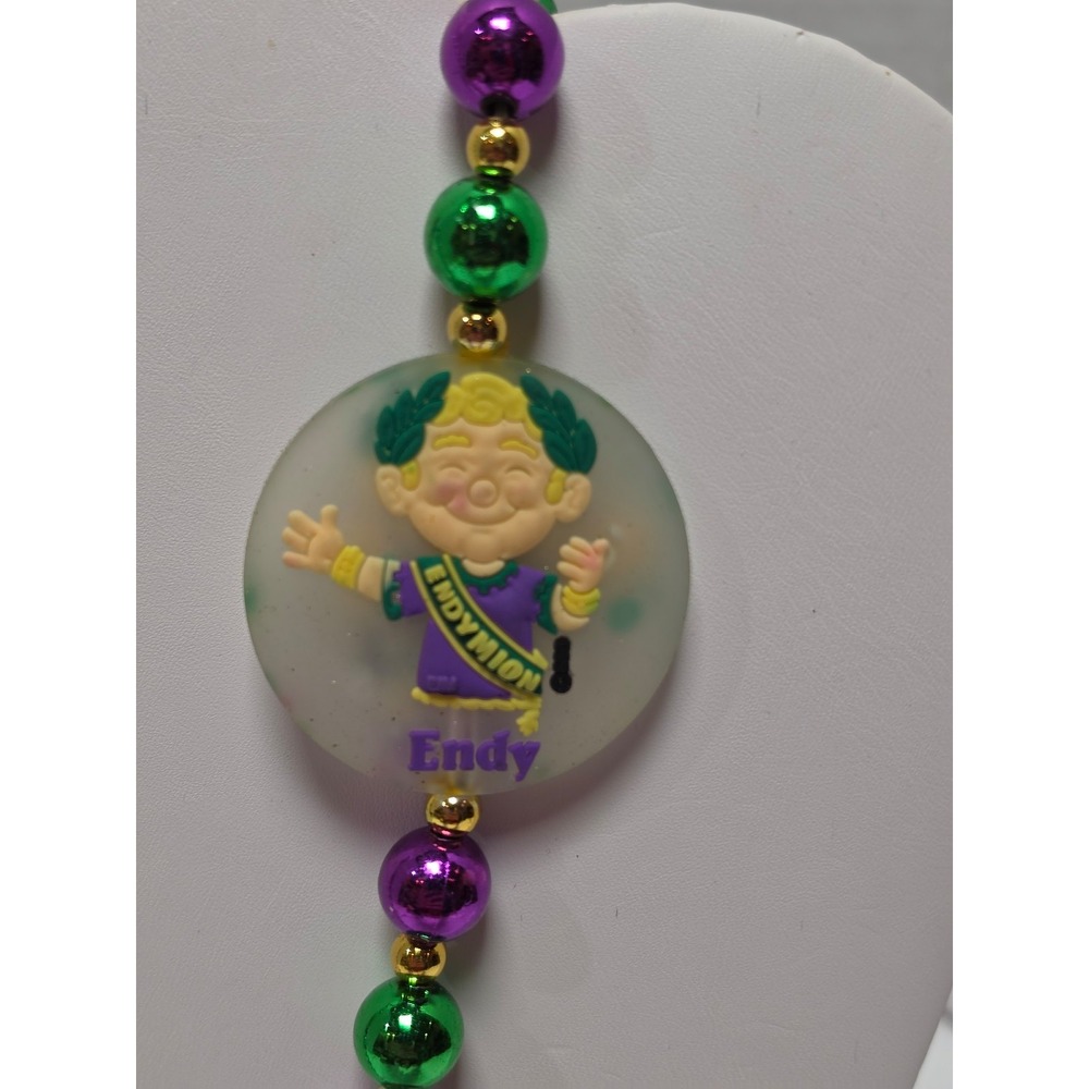 Endymion Mardi Gras beads featuring two medallions of the mascot banner